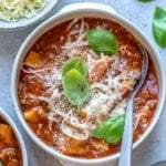 lasagna soup in white bowl with spoon in it