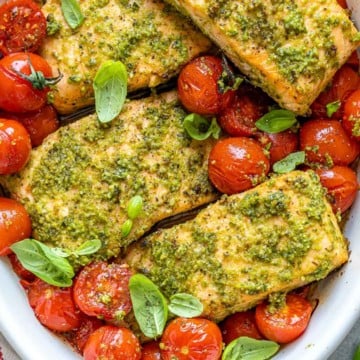 baked salmon and tomatoes in white dish
