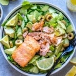 salmon topped over salad bowl