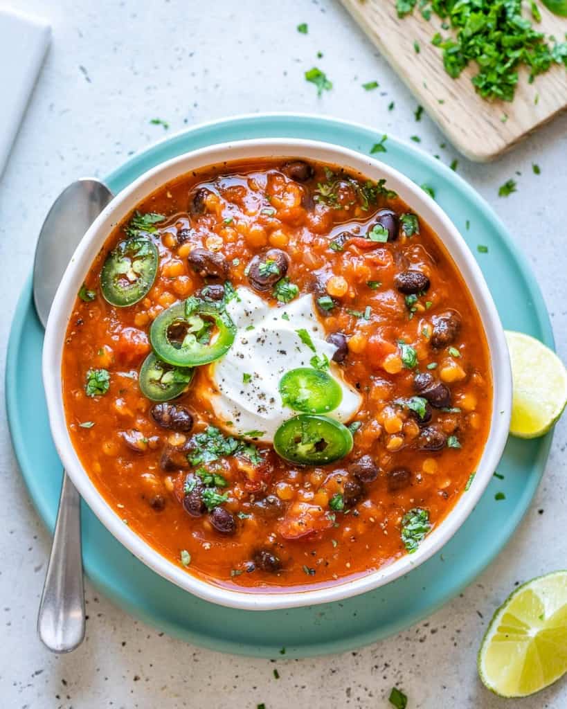 chili with vegan cream topping in a bowl.