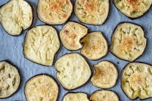 Sliced eggplant baked on a sheet pan.