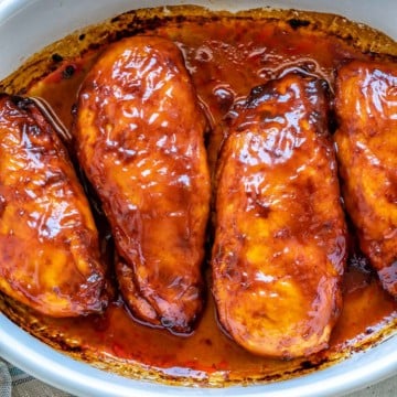 top view bbq chicken breast in white dish