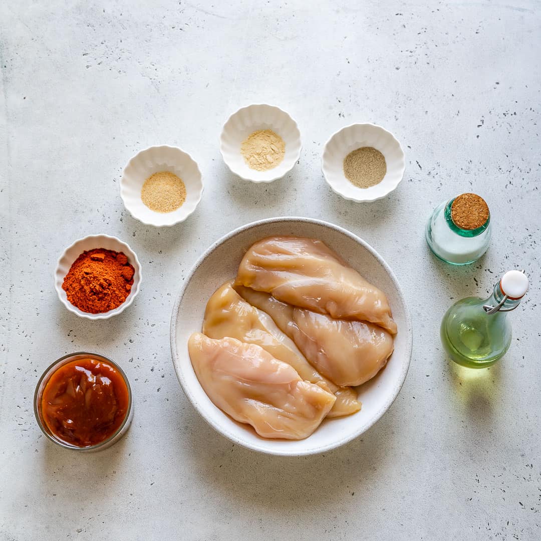 Ingredients for baked BBQ chicken breast on counter