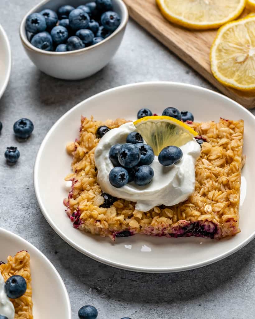 Baked Blueberry Oatmeal square on a white plate.