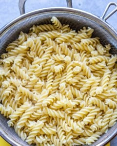 cooked pasta in colander.