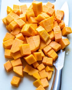 chopped butternut squash on a platter