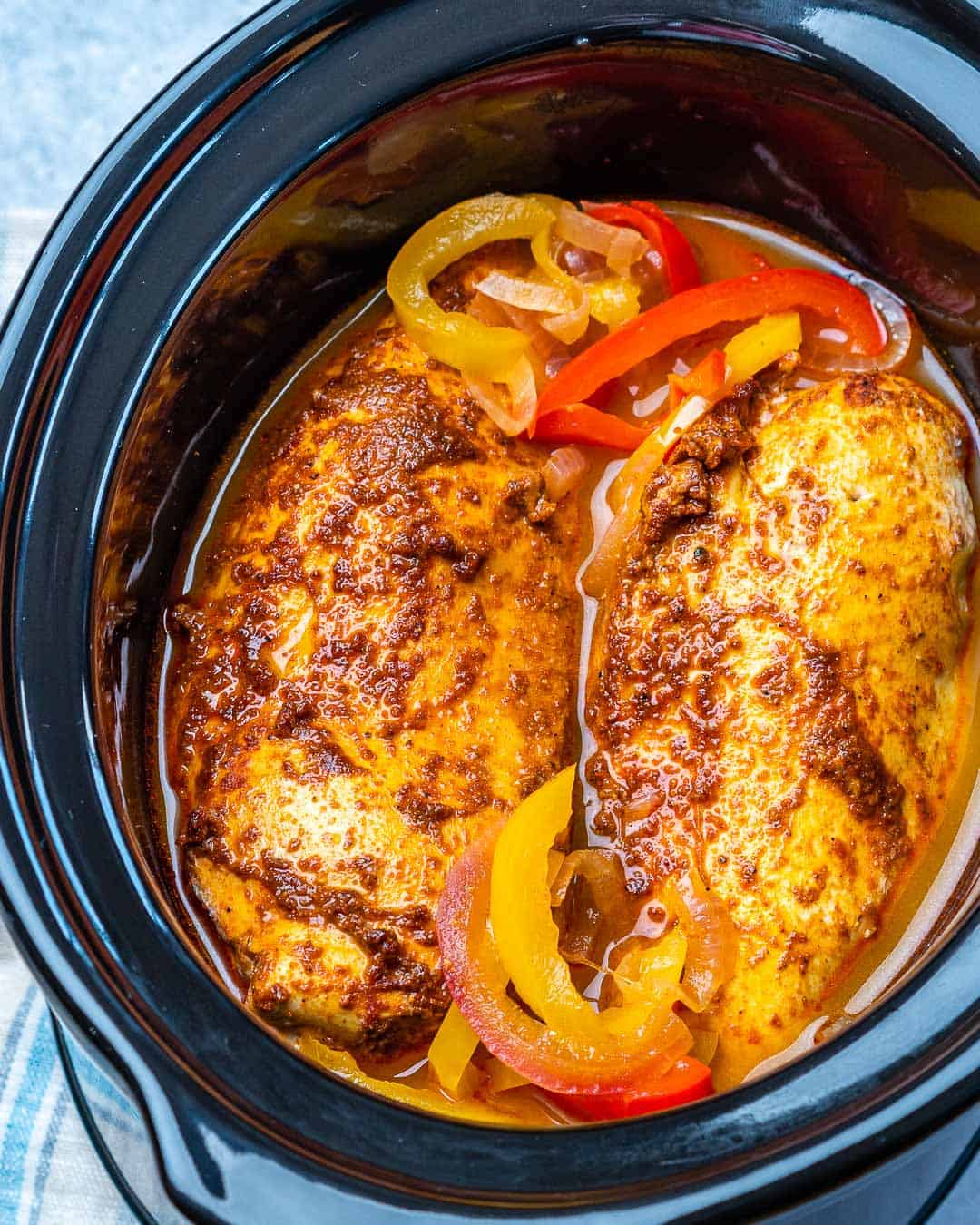 Whole chicken breasts and sliced bell peppers cooked in slow cooker. 