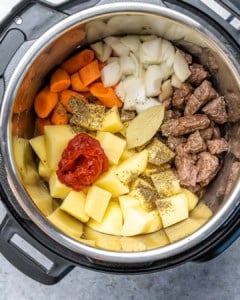 Overhead view of ingredients in instant pot, before cooking.