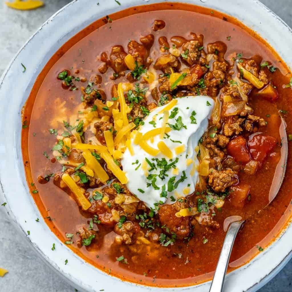top view of chili with spoon in bowl