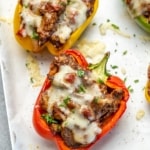Side view of stuffed peppers on a plate.
