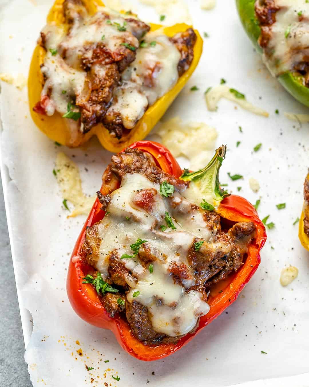 Side view of stuffed peppers on a plate.