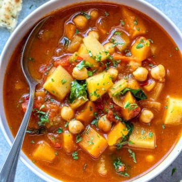 top view of veggie soup bowl with spoon in it