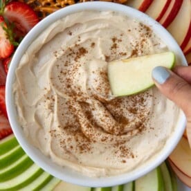 close up peanut butter fruit dip in a white bowl