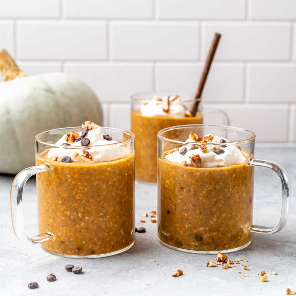 side view of pumpkin overnight oats in 3 cups 