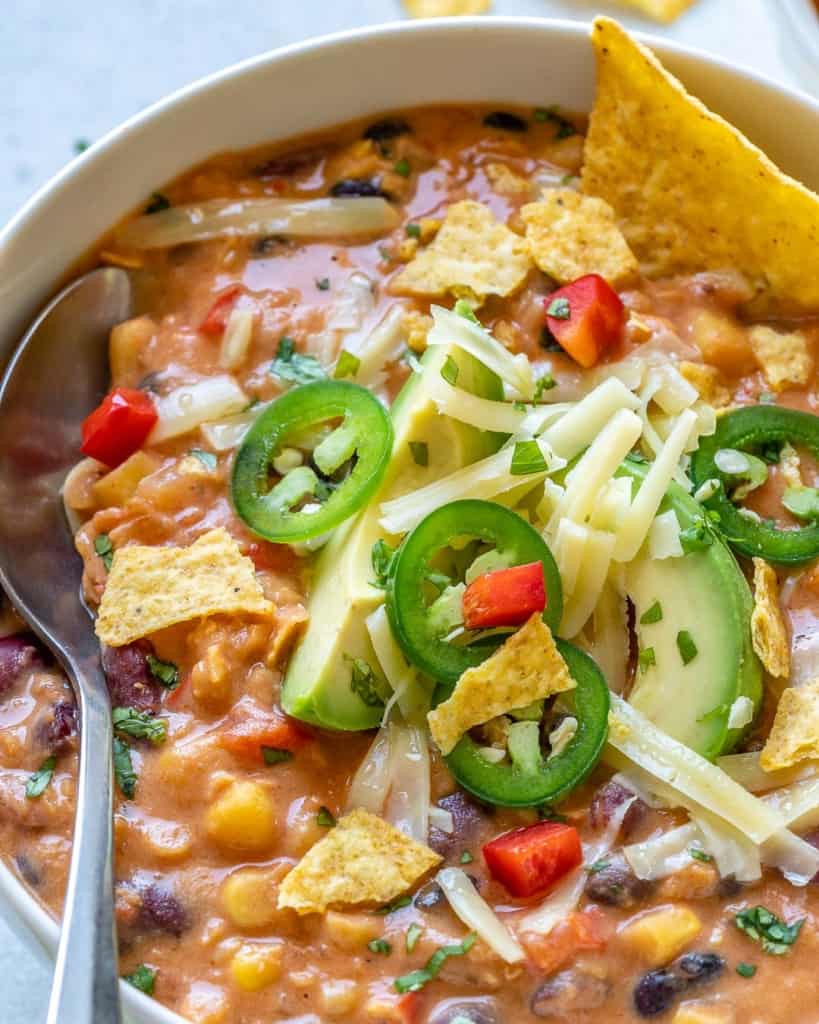 close up view of tortilla soup in white bowl
