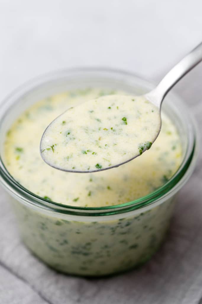 Spooning out creamy cilantro lime dressing.