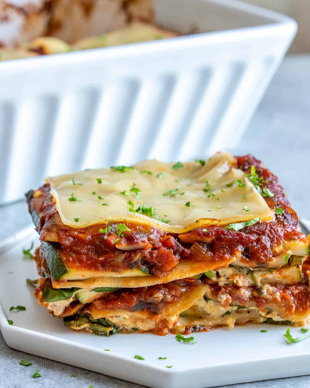 side view of lasagna piece on a plate