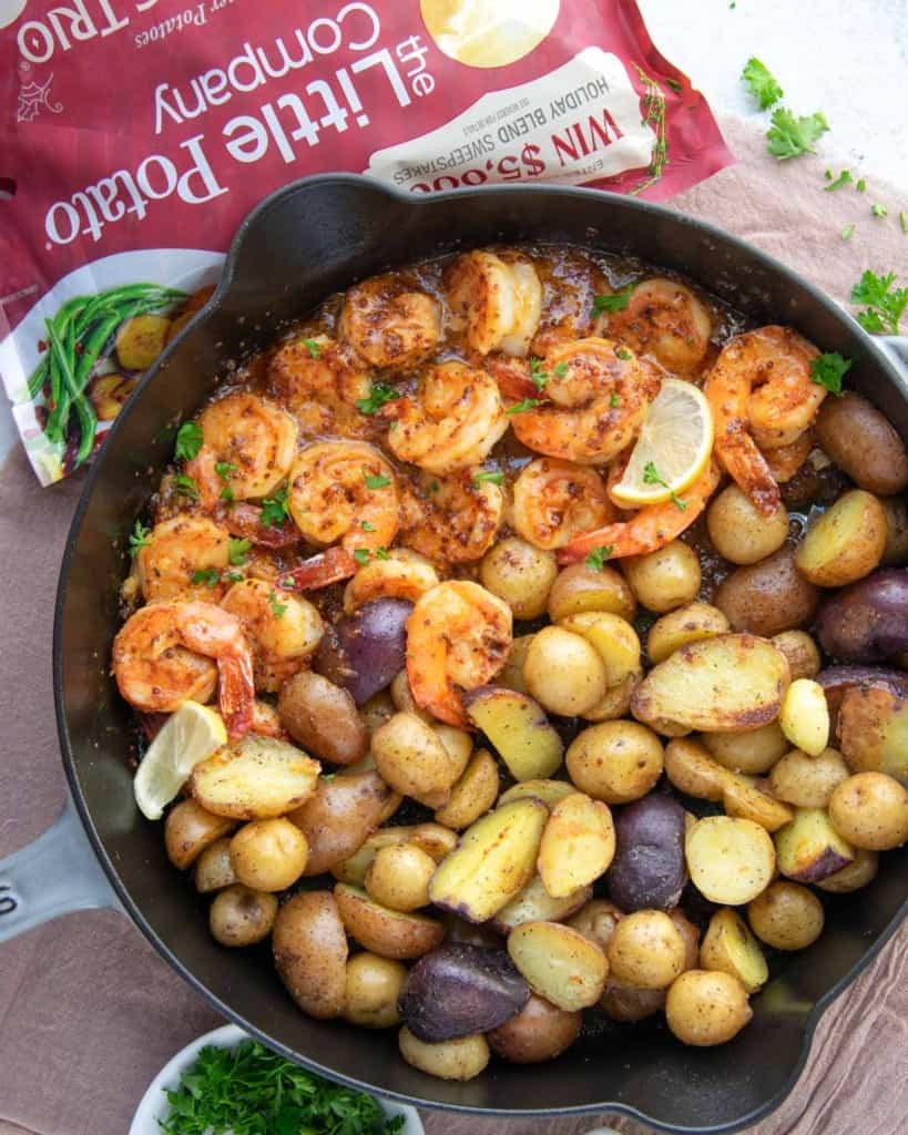 top view shrimp and potatoes in skillet 