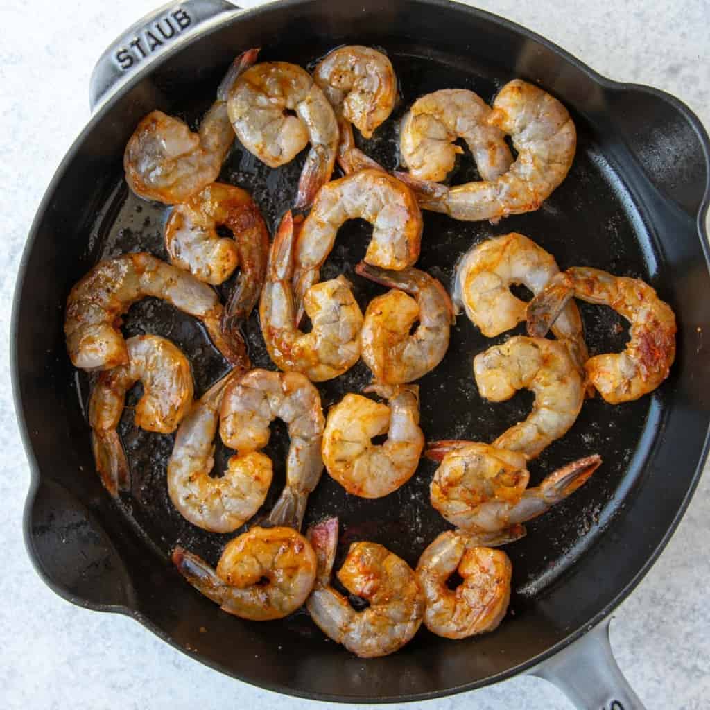 raw shrimp in skillet before cooking 