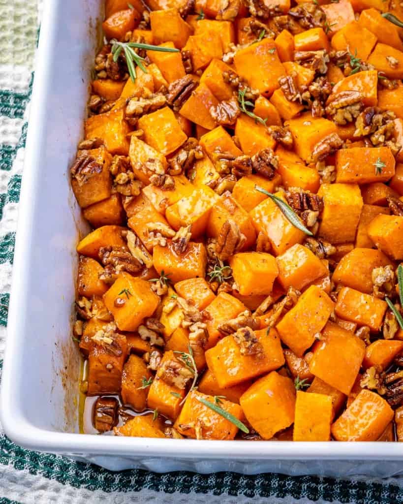 A baking dish with maple pecan roasted sweet potatoes. 