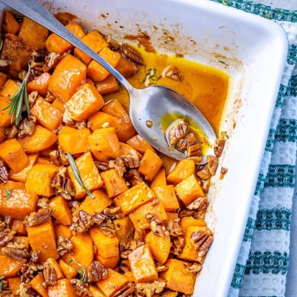 spoon in roasted sweet potato dish