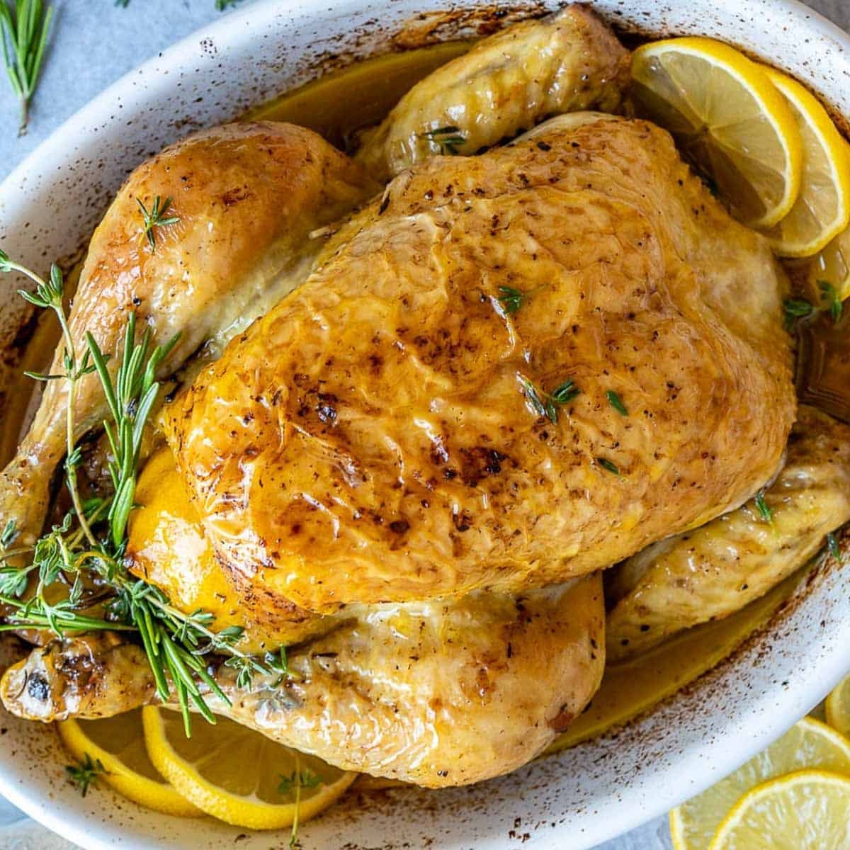 whole roasted chicken in a dish.