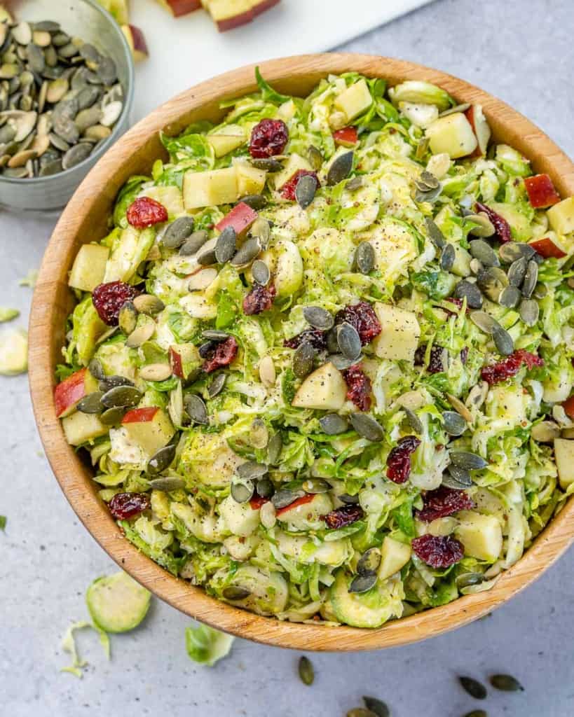 top view of brussel sprouts salad in a brown bowl