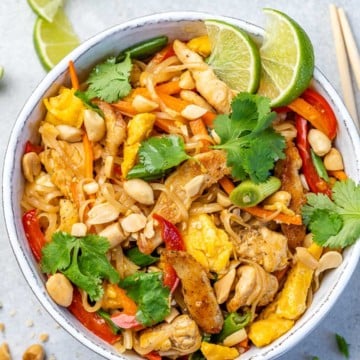 top view of chicken pad thai in white bowl