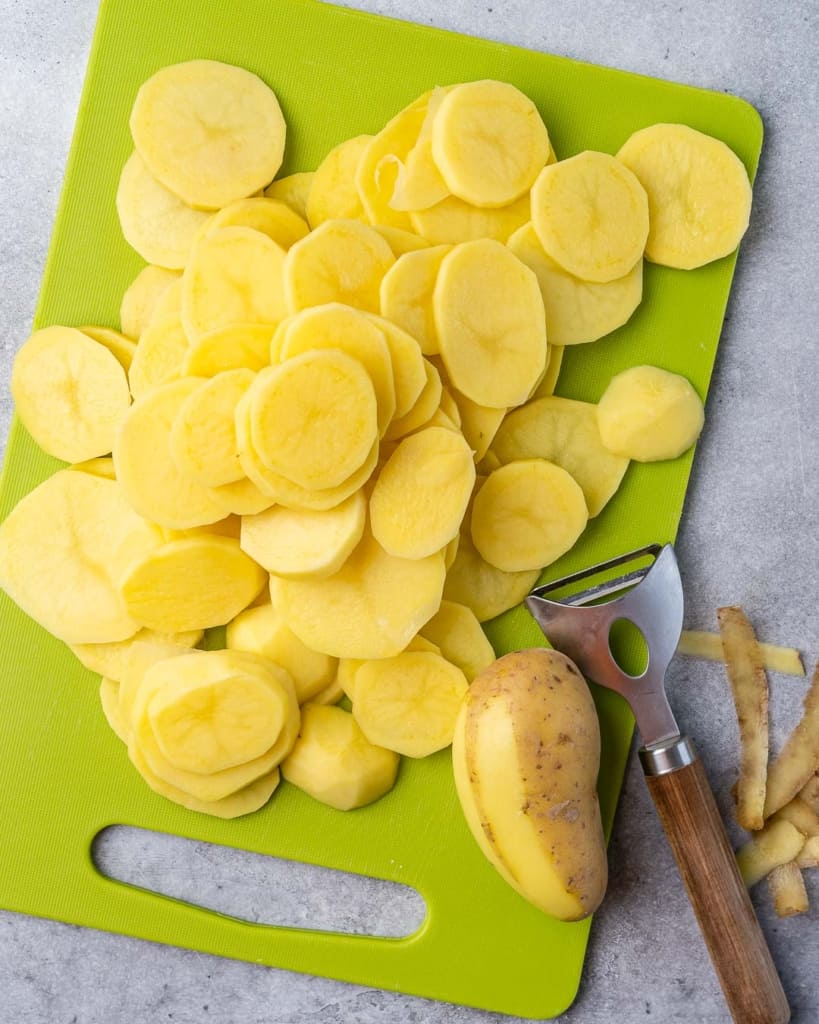 slices of potatoes on a green cutting board