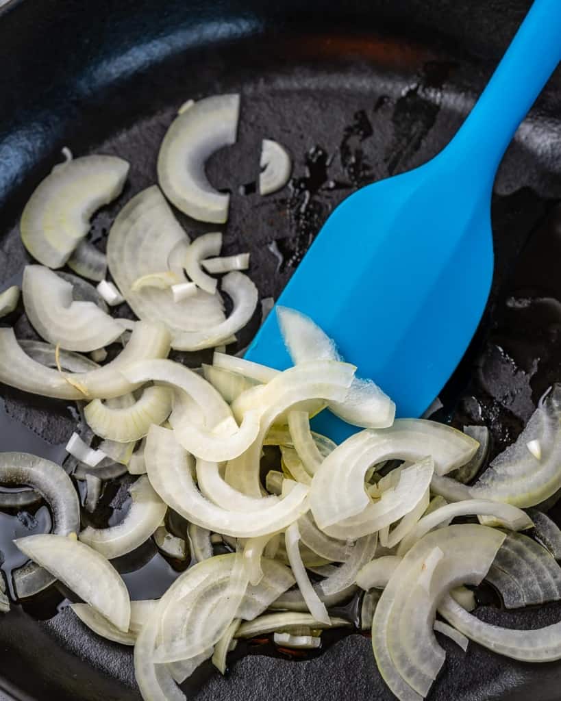 onion slices sauteed in a black skillet