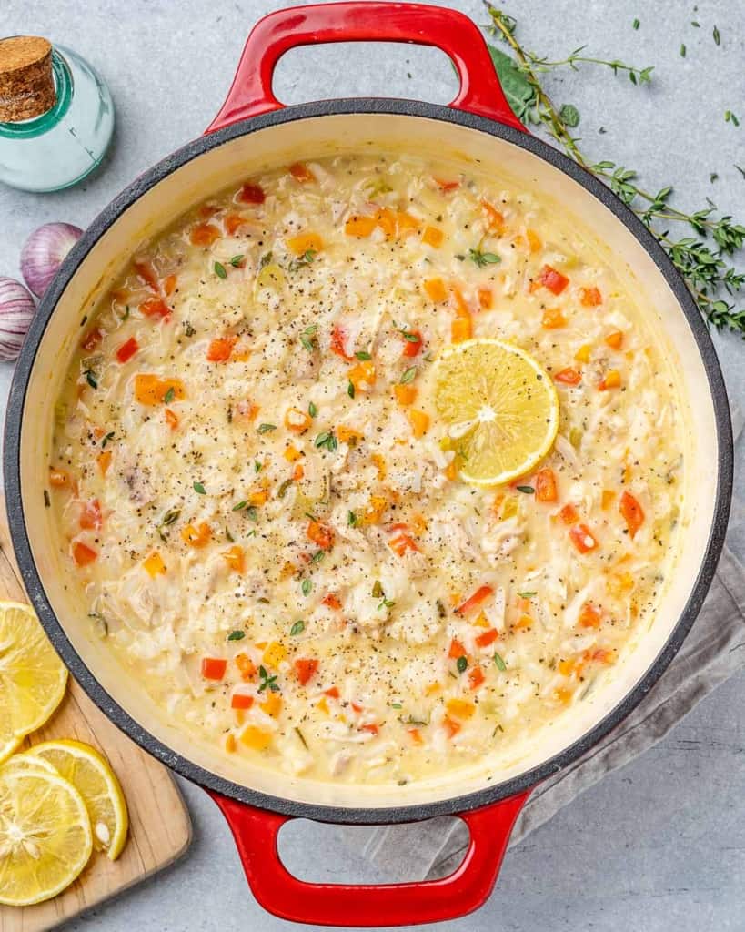 Overhead photo of turkey rice soup in a Dutch oven.