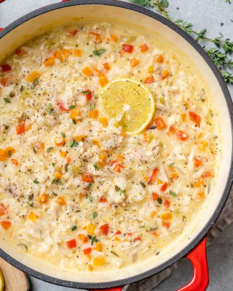 Turkey soup with a slice of lemon in a pot.