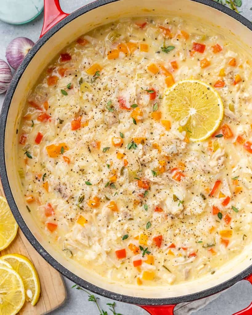 Turkey soup with a slice of lemon in a pot.