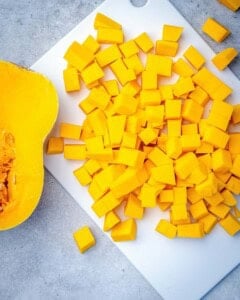 chopped butternut squash on a cutting board.