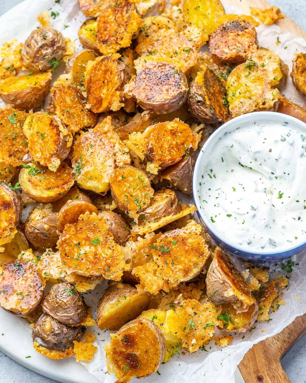 crispy potatoes on a plate with ranch dip