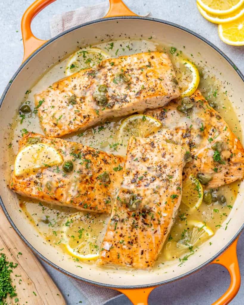 top view seared salmon piccata in lemon sauce