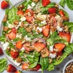 top view strawberry and spinach salad with pecans and feta