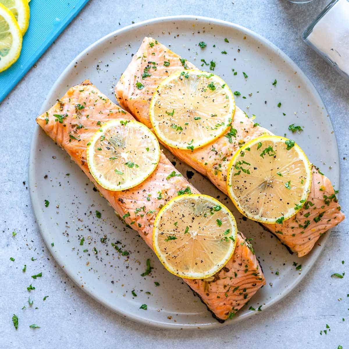 Two baked salmon on a plate.