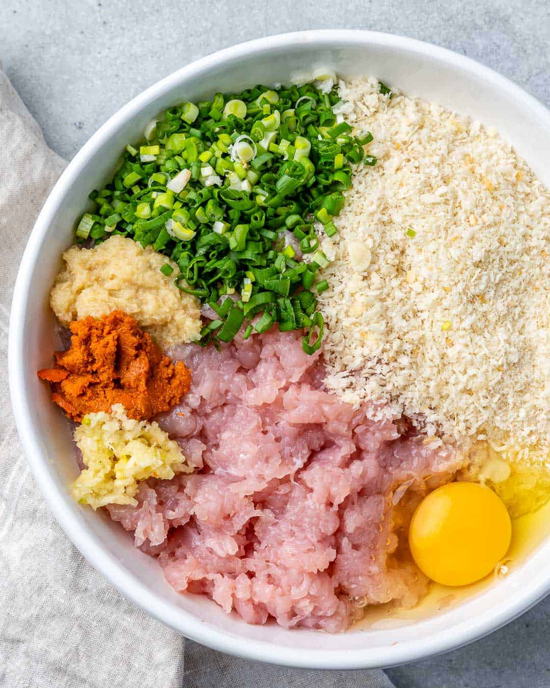 meatball ingredients place in a bowl before mixing.