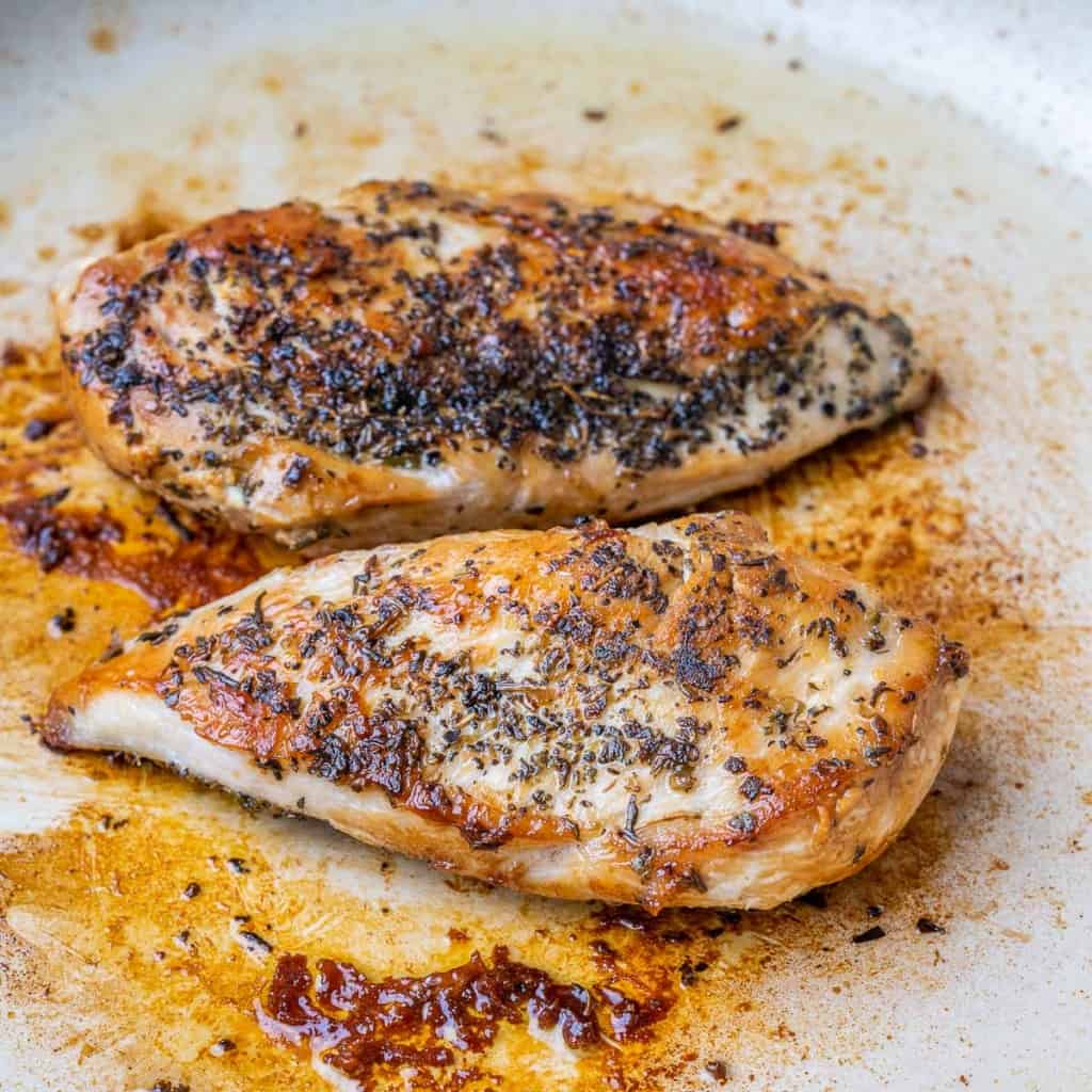 Two cooked chicken breasts