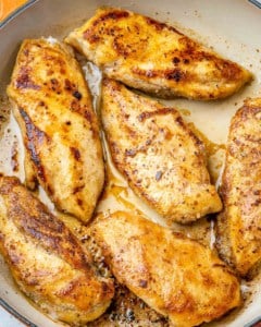 pan seared coconut chicken breast in a skillet