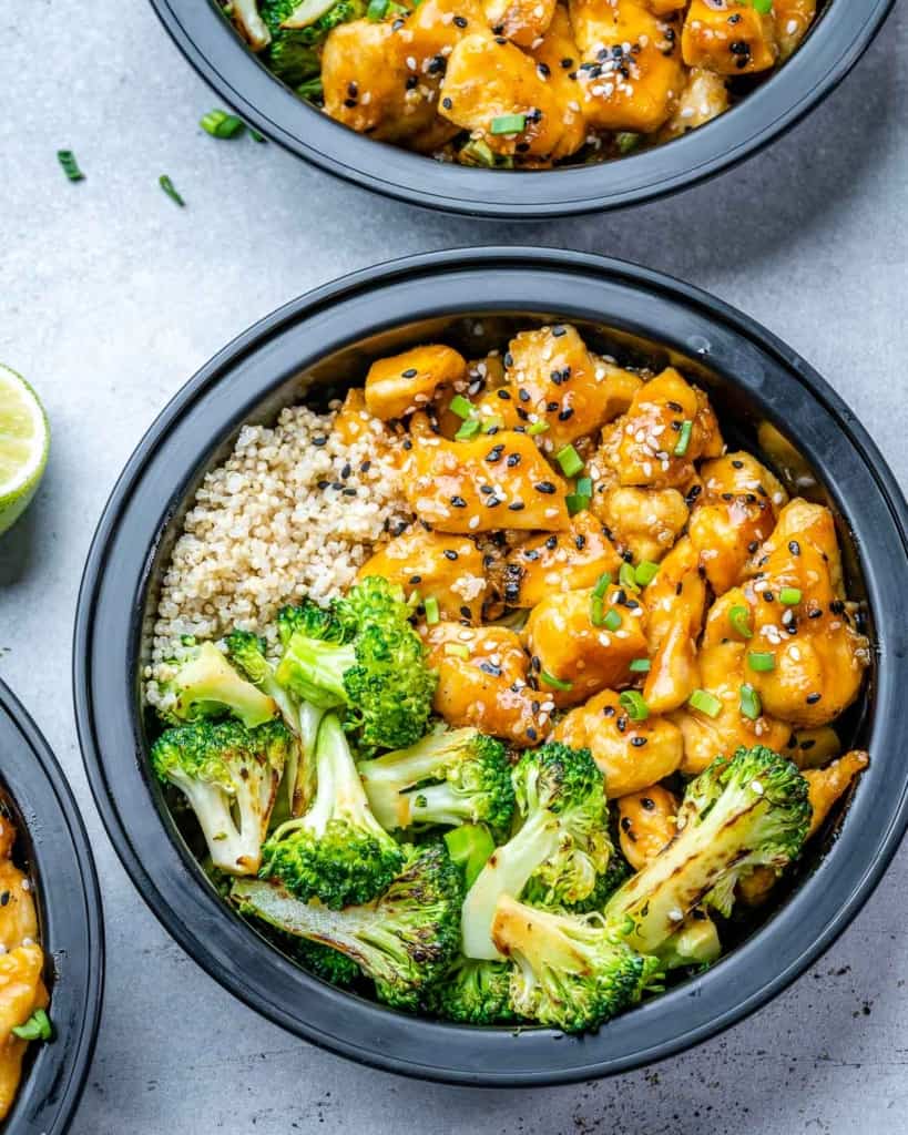 top view of a bowl of honey chicken, broccoli, and quinoa