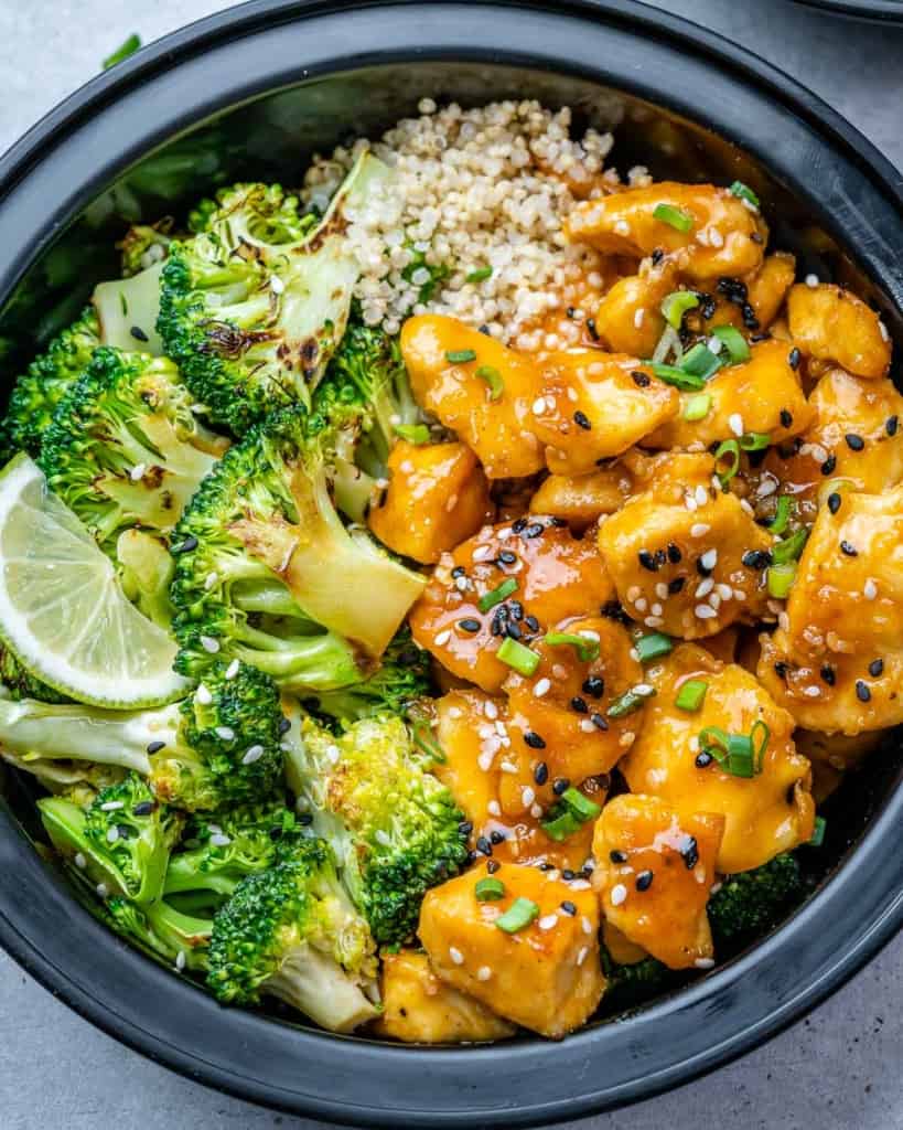 close up honey chicken with broccoli and brown rice