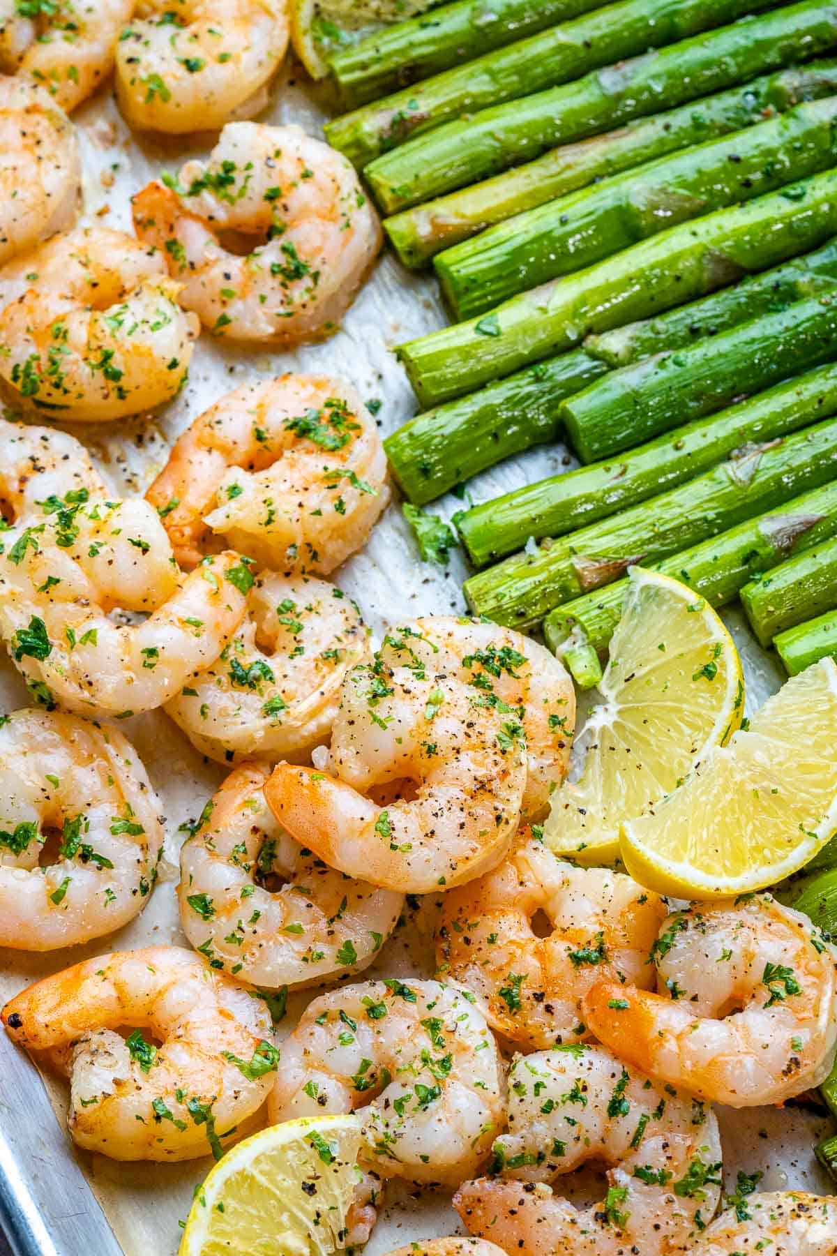 Garlic lemon shrimp and asparagus baked on sheet pan.