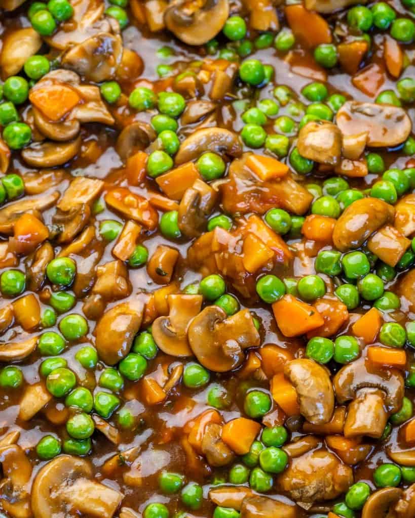 Thickened filling with mushrooms, carrots, and peas. 