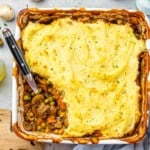 top view vegetarian shepherds pie with spoon scooping some