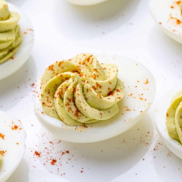 image of a single deviled egg on a white surface