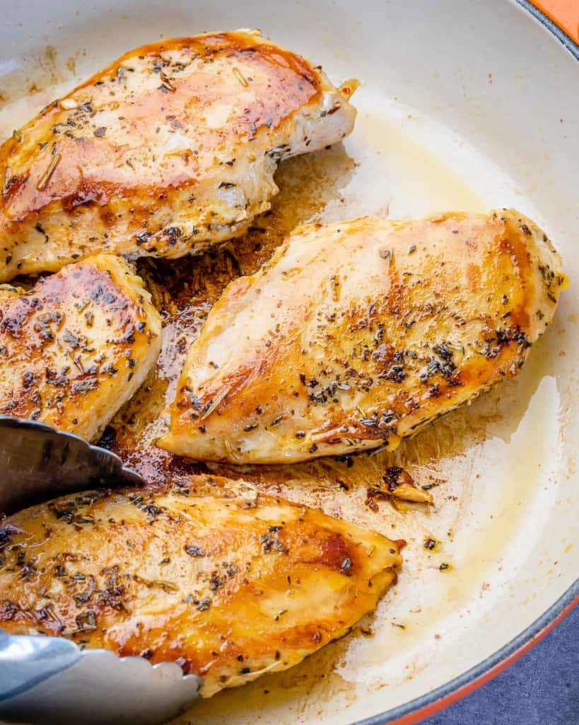 cooked chicken breasts in a skillet 