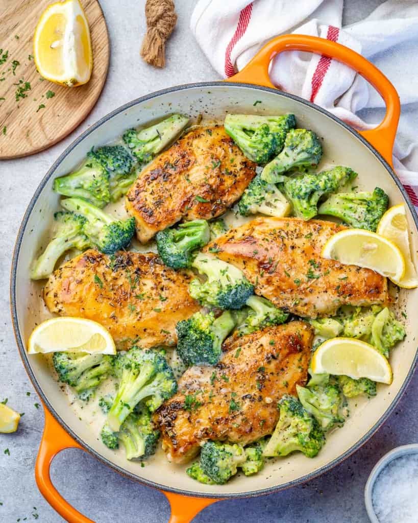 orange skillet with creamy chicken and broccoli