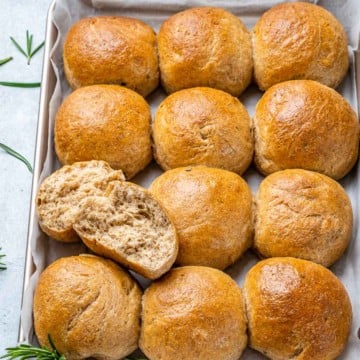 top view dinner rolls lined up on a pan